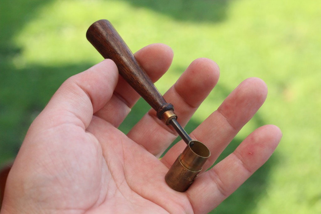 An old powder laddle: good and fast way to fill the vials, but be careful how many times you tap the measure.